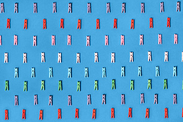 Image showing Clothespins colored on a blue background.