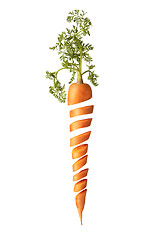 Image showing Cut fresh juice natural carrot root with green leaf.