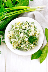 Image showing Salad with potatoes and sorrel on wooden board top