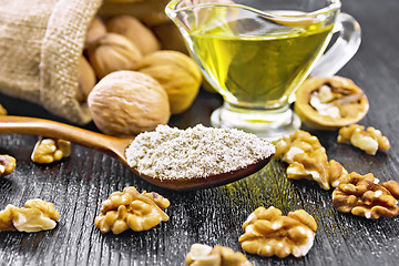 Image showing Flour walnut in spoon on dark board