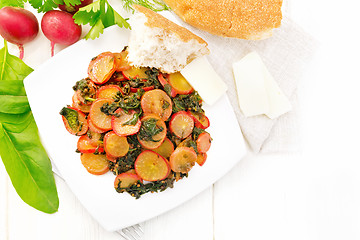 Image showing Radish with spinach and spices in plate on board top