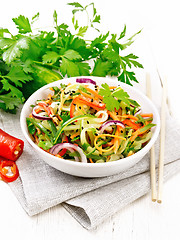 Image showing Salad of cucumber in bowl on white board