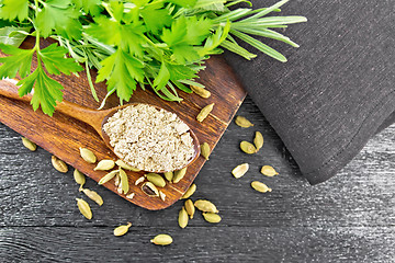 Image showing Cardamom ground in spoon on board top