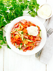 Image showing Salad of sausage and spicy carrots on light board top