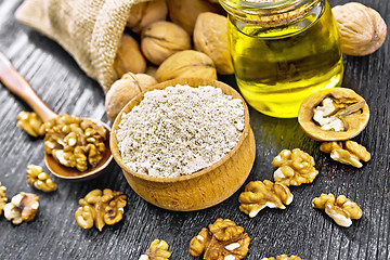 Image showing Flour walnut in bowl on dark board