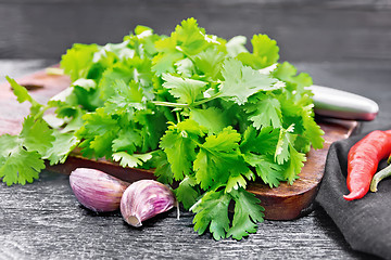 Image showing Cilantro fresh with garlic on black board