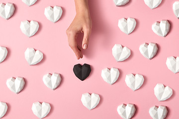 Image showing Gypsum hearts pattern with woman\'s hand.