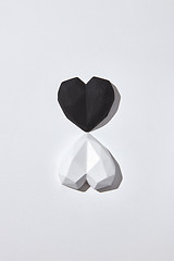 Image showing Two gypsum hearts black and white with shadows.