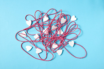Image showing Holiday composition with tangled rope and small hearts.
