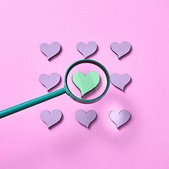 Image showing Square heart pattern with magnifying glass above.