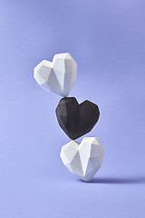 Image showing Vertical pillar from plaster black and white hearts.