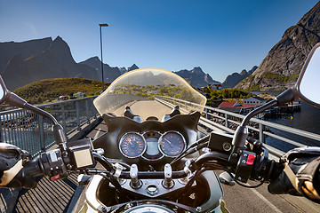 Image showing Biker rides on road in Norway. First-person view.