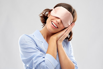 Image showing happy young woman in pajama and eye sleeping mask