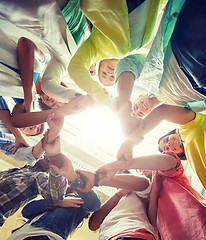 Image showing group of international students holding hands