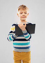 Image showing boy in striped pullover with tablet pc computer