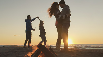 Image showing Friends having fun at beach on autumn day