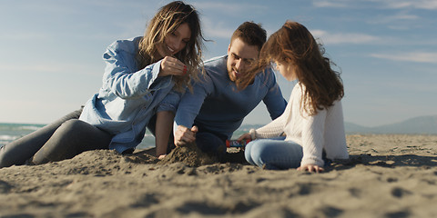 Image showing Young family enjoying vecation during autumn