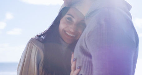 Image showing Couple having fun on beautiful autumn day at beach