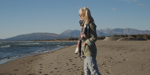 Image showing Young woman enjoying the warm autumn day