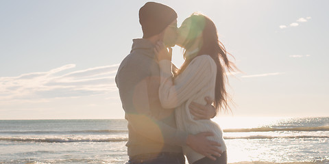 Image showing Couple having fun on beautiful autumn day at beach