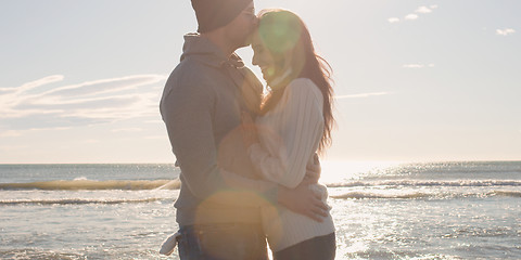 Image showing Couple having fun on beautiful autumn day at beach