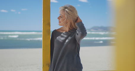 Image showing Young woman enjoying the warm autumn day