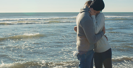 Image showing Couple having fun on beautiful autumn day at beach