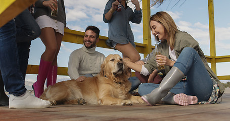 Image showing Group of friends having fun on autumn day at beach