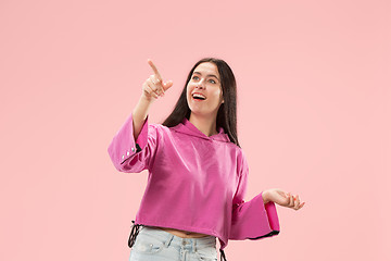 Image showing Beautiful woman looking suprised isolated on pink