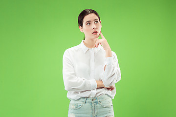 Image showing Young serious thoughtful business woman. Doubt concept.