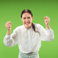 Image showing Winning success woman happy ecstatic celebrating being a winner. Dynamic energetic image of female model