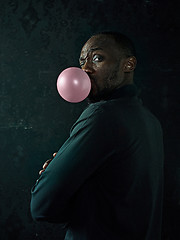 Image showing The african american man with bubble gum