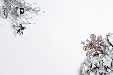 Image showing Christmas decorative composition of toys on a white background surrealism. Top view