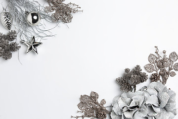 Image showing Christmas decorative composition of toys on a white background surrealism. Top view