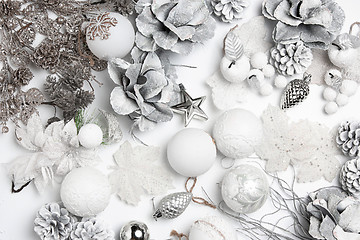 Image showing Christmas decorative composition of toys on a white background surrealism. Top view