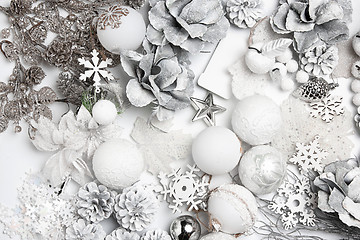 Image showing Christmas decorative composition of toys on a white background surrealism. Top view