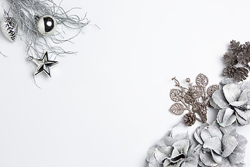 Image showing Christmas decorative composition of toys on a white background surrealism. Top view