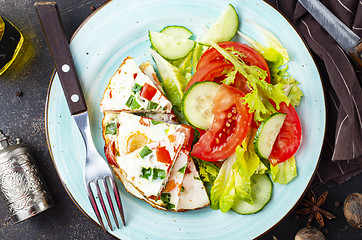 Image showing omelette with vegetables on white plate