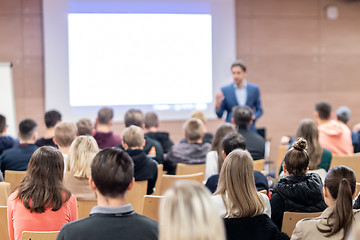 Image showing Business speaker giving a talk at business conference event.