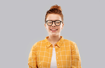 Image showing smiling red haired teenage student girl in glasses