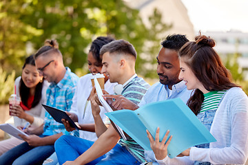 Image showing group of happy students with notebooks and drinks