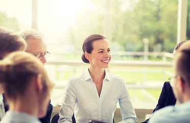 Image showing smiling business people meeting in office