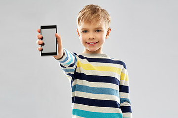 Image showing smiling boy showing blank screen of smartphone