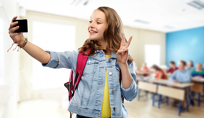 Image showing teenage student girl taking selfie by smartphone