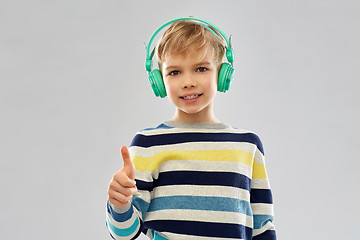 Image showing boy in headphones showing thumbs up