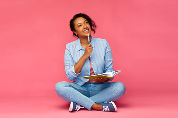 Image showing student woman with diary or notebook thinking