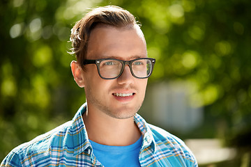 Image showing portrait of young man in glasses outdoor in summer