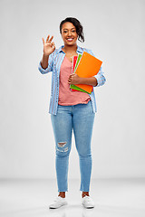 Image showing african american student woman with notebooks