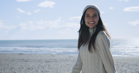 Image showing Girl In Autumn Clothes Smiling on beach