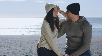 Image showing Couple having fun on beautiful autumn day at beach